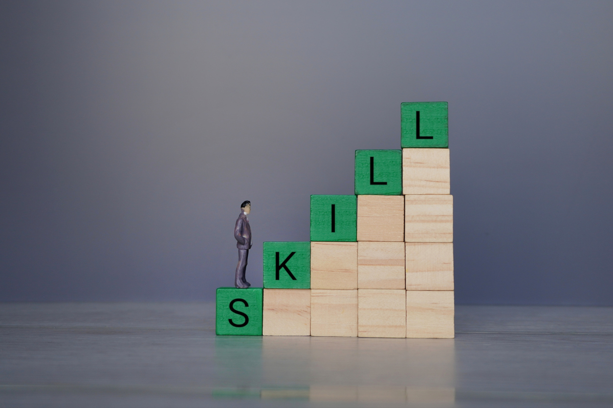 Human figure and text SKILL. Exemplary for the eLearning and translation topic. Upskill-image