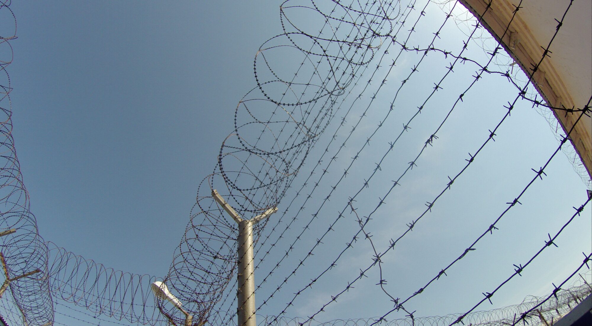 Barbed Wire Under a Blue Sky